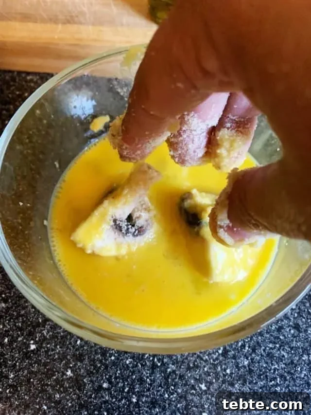 Crispy Air Fryer Mushrooms for Keto and Low-Carb Diets 4 dip mushrooms in egg wash
