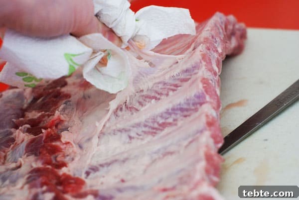 Orange Sticky Finger RIbs | Heather Likes Food removing the membrane from the back of pork ribs