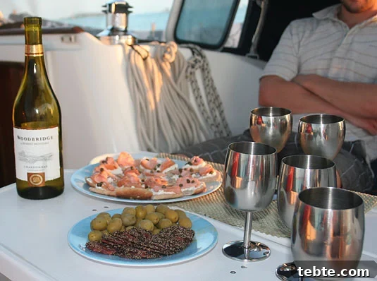 A fancy happy-hour with white wine, black pepper dry sausage, green olives and smoked salmon canapés. A fancy happy-hour with white wine, black pepper dry sausage, green olives and smoked salmon canapés.