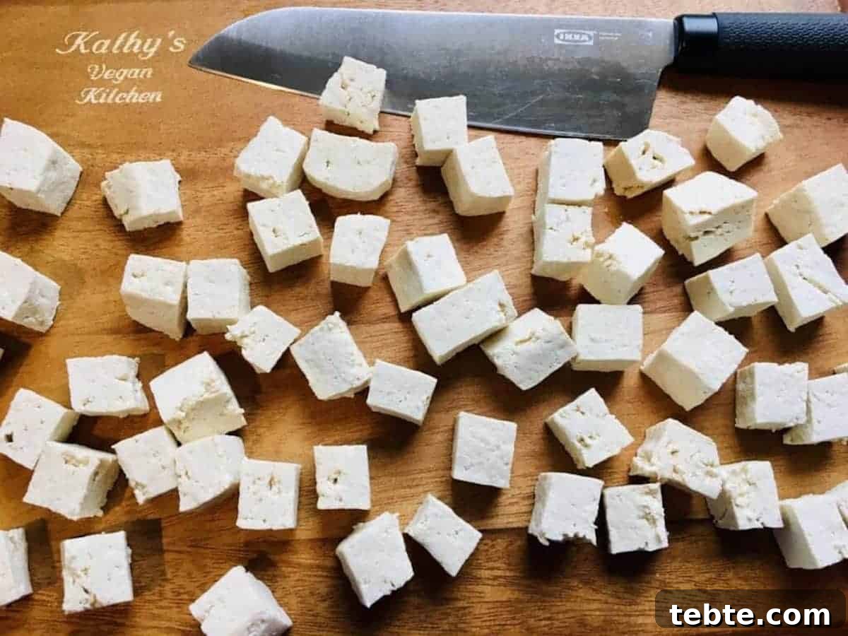Tofu cut up into pieces. 