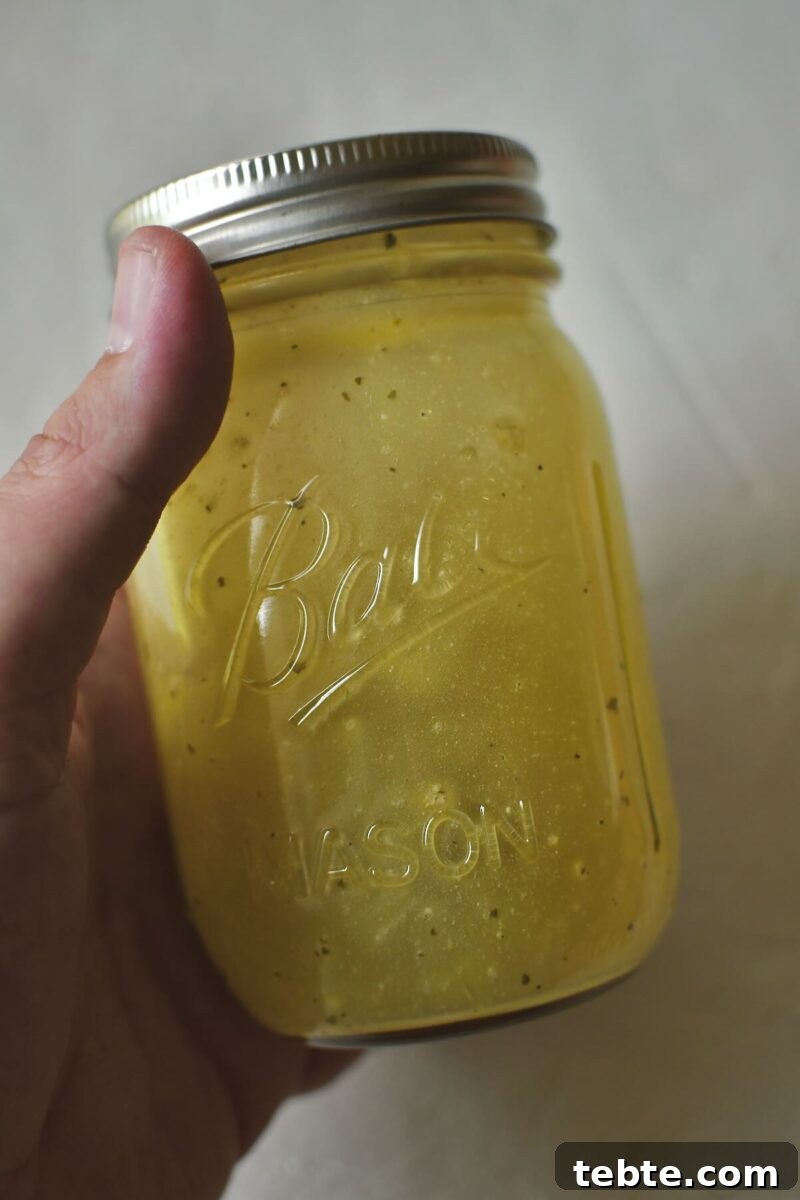 Creamy Pea Salad with Bacon and Red Onion 6 Ranch Vinaigrette mixed up in a jar.