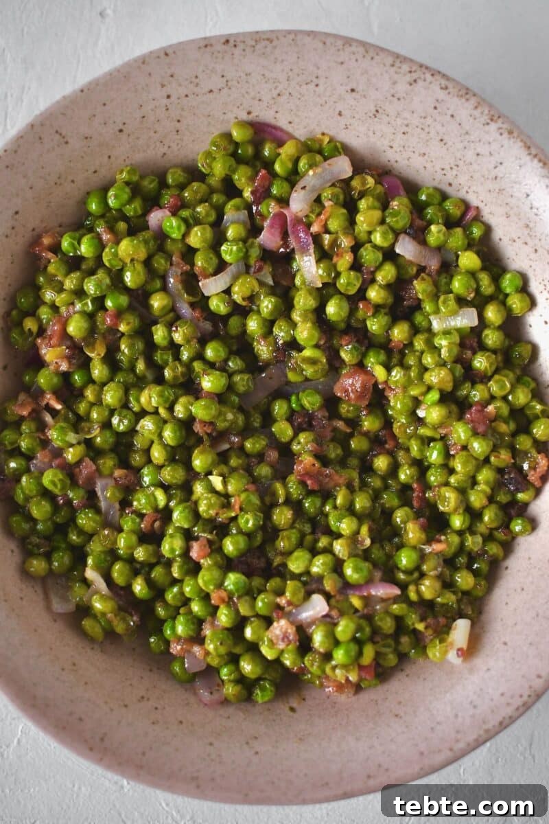 Creamy Pea Salad with Bacon and Red Onion 7 Peas in a serving dish after deglazing the saute pan with the vinaigrette.