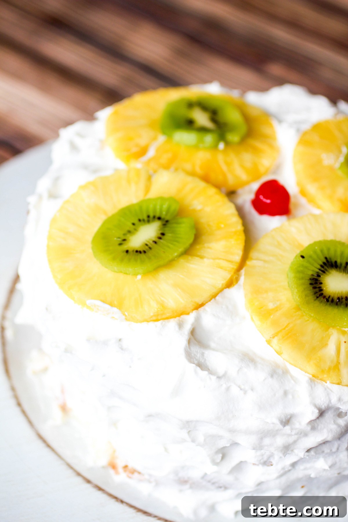 Tropical Layered Poke Cake Recipe With Coconut and Pineapple 2 Tropical Layered Poke Cake