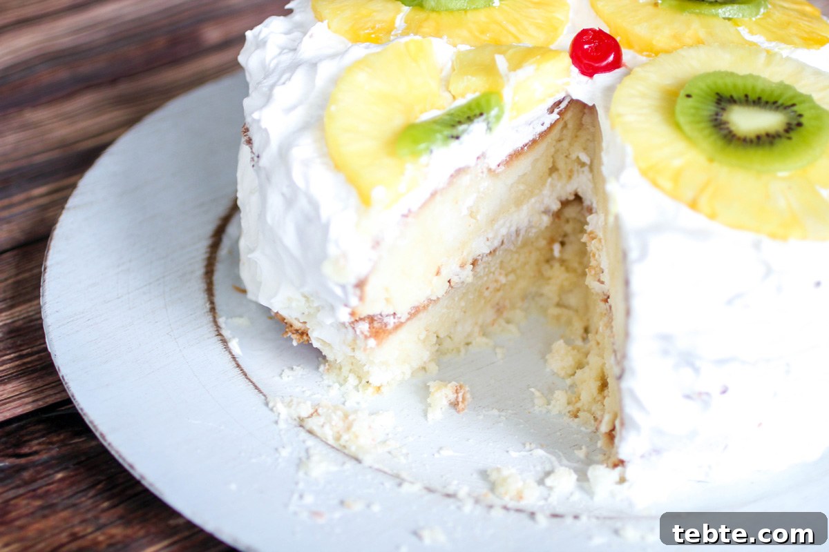 Tropical Layered Poke Cake Recipe With Coconut and Pineapple 3 Tropical Layered Poke Cake