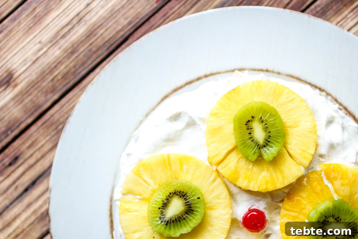 Tropical Layered Poke Cake Recipe With Coconut and Pineapple 4 Tropical Layered Poke Cake