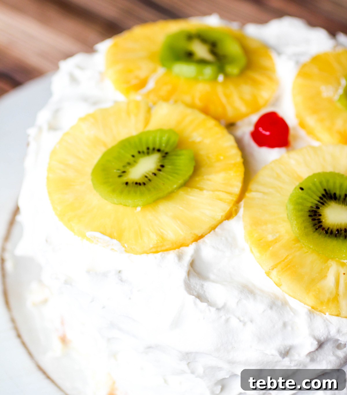 Tropical Layered Poke Cake Recipe With Coconut and Pineapple 5 Tropical Layered Poke Cake