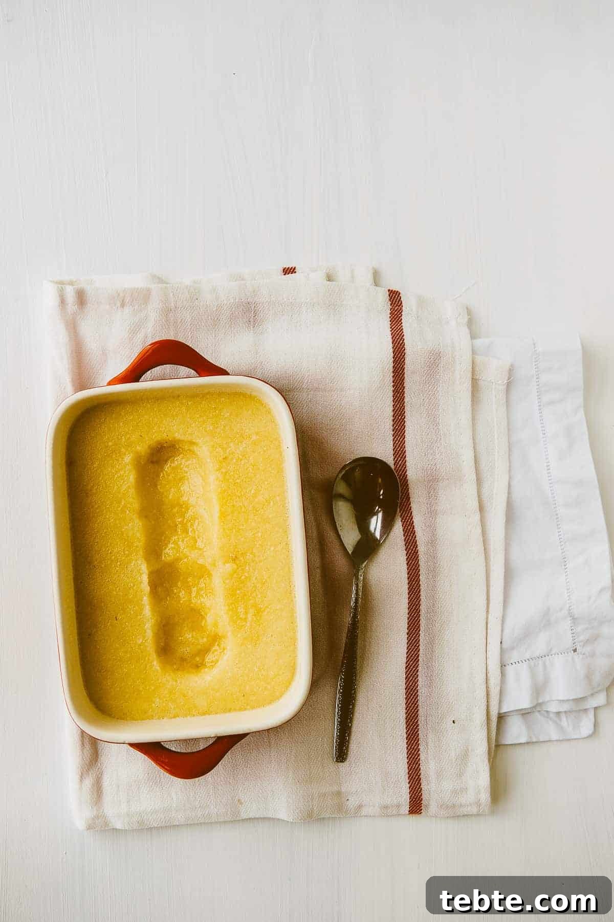 Refreshing Pineapple Granita Recipe: Tangy Frozen Dessert Guide 2 birds eye view of ceramic pan filled with homemade pineapple granita