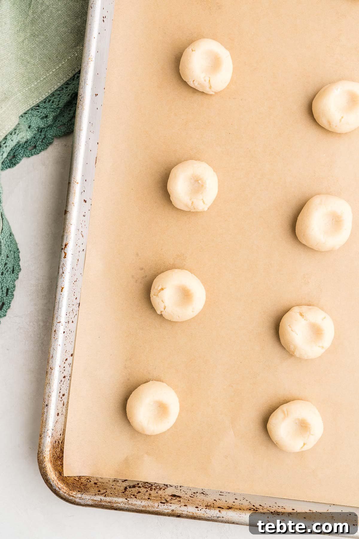 Raspberry Almond Shortbread Cookies Recipe — Buttery Jam-Filled Treats 11 Filling thumbprints