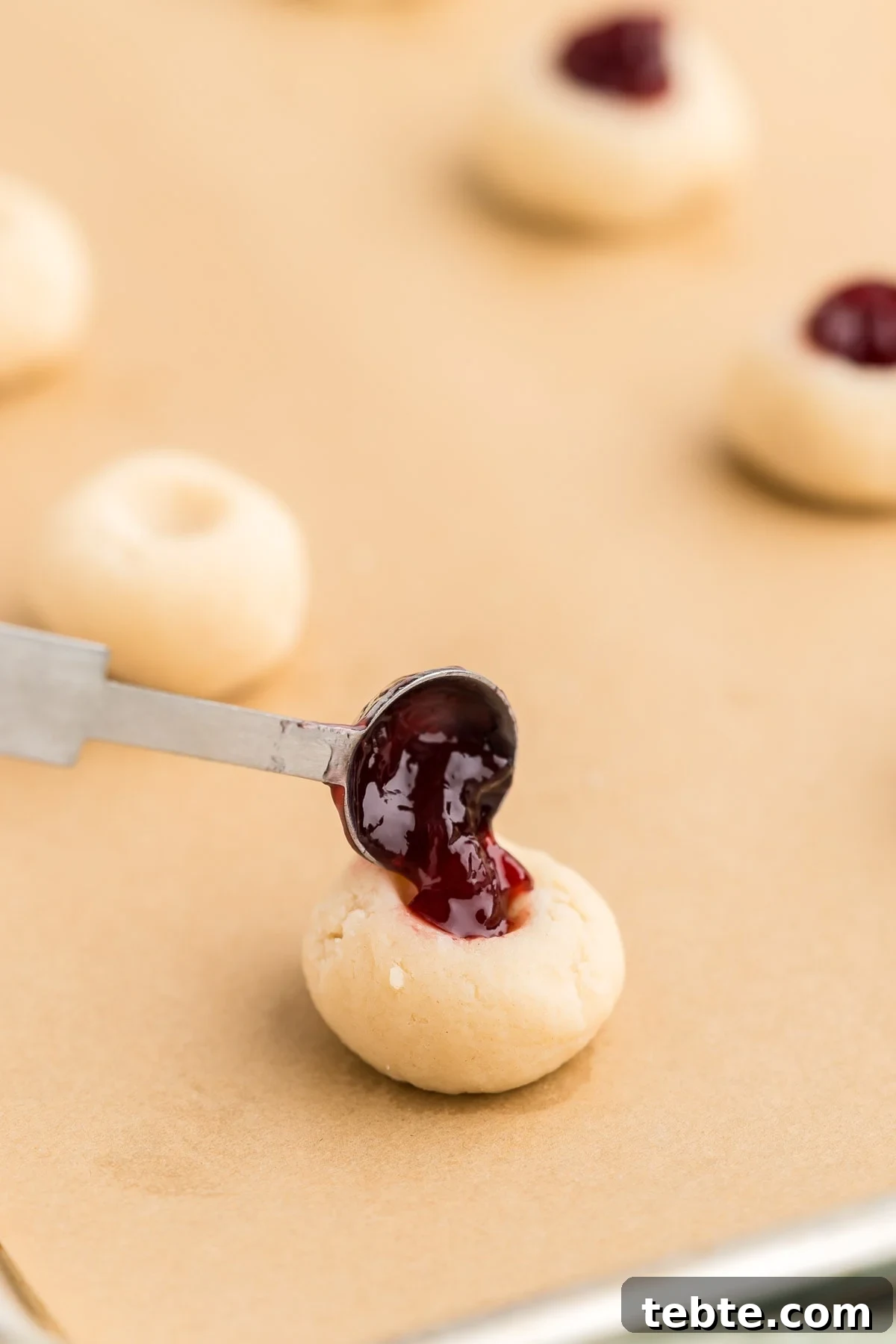 Raspberry Almond Shortbread Cookies Recipe — Buttery Jam-Filled Treats 12 Baked cookies cooling