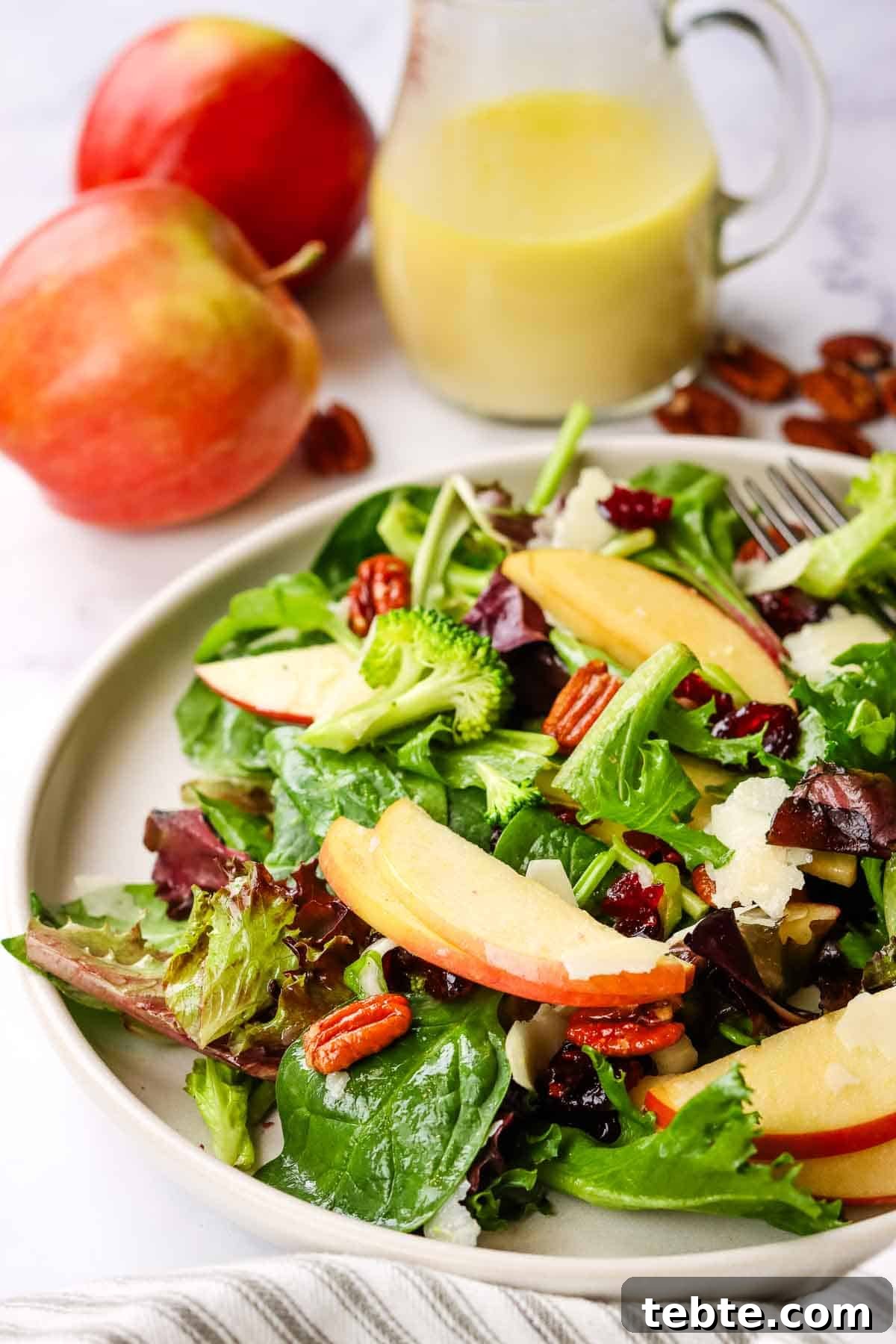Crisp Apple and Pecan Salad with Maple Vinaigrette 11 a closeup of a dish of apple pecan salad