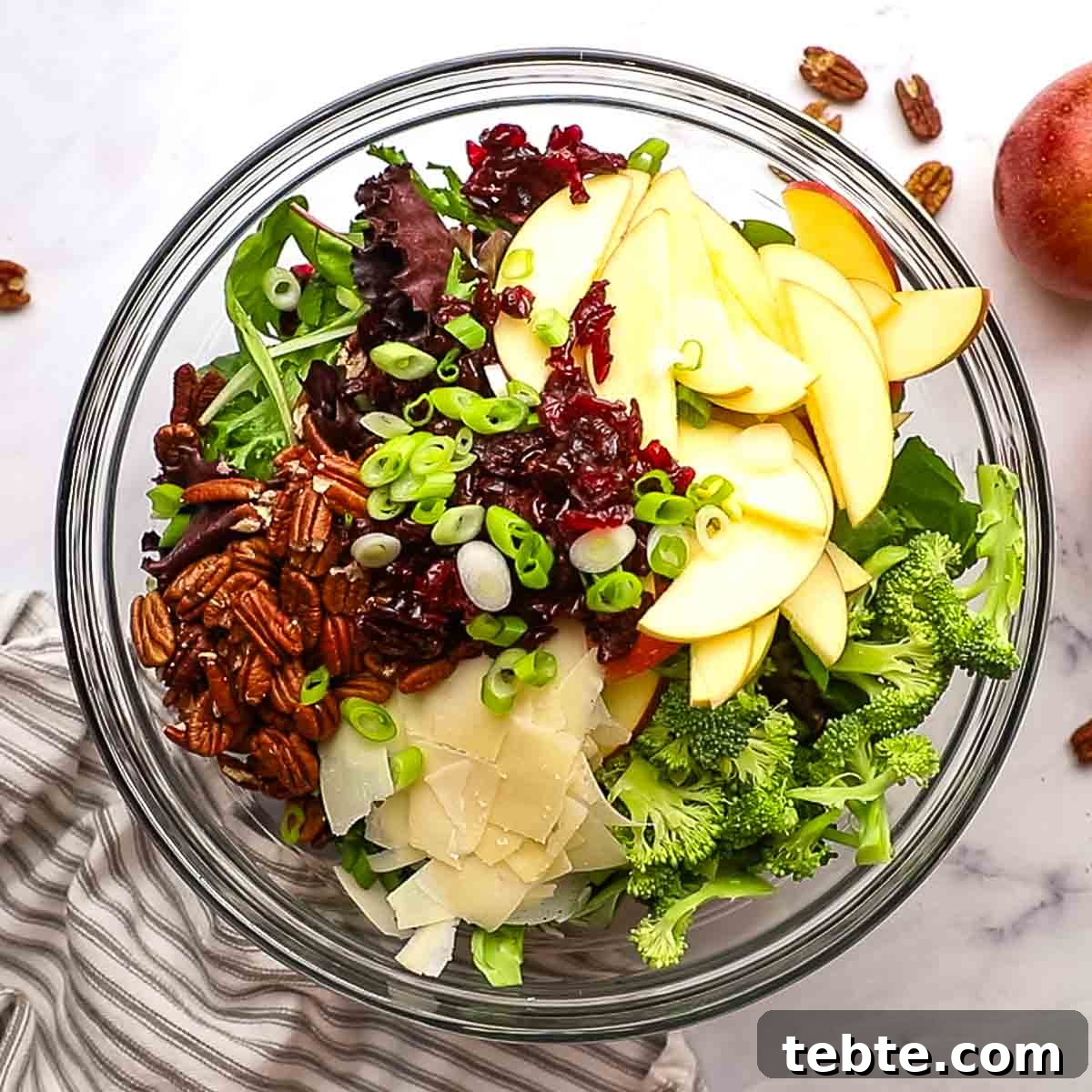 Crisp Apple and Pecan Salad with Maple Vinaigrette 8 apple pecan salad ingredients in a large salad bowl