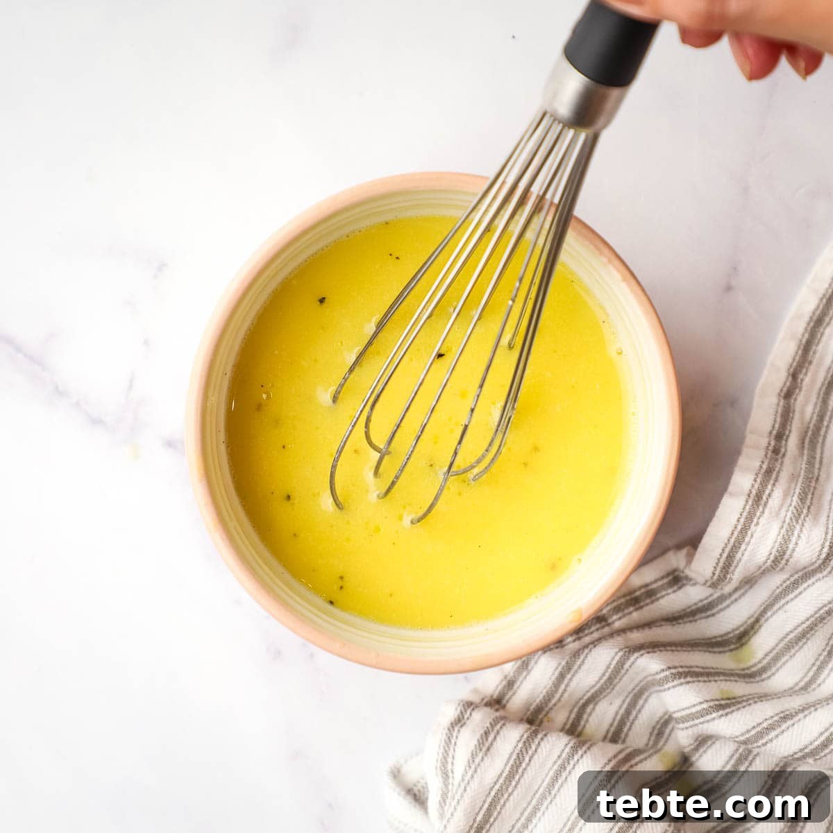 Crisp Apple and Pecan Salad with Maple Vinaigrette 9 whisked maple dressing in a small bowl