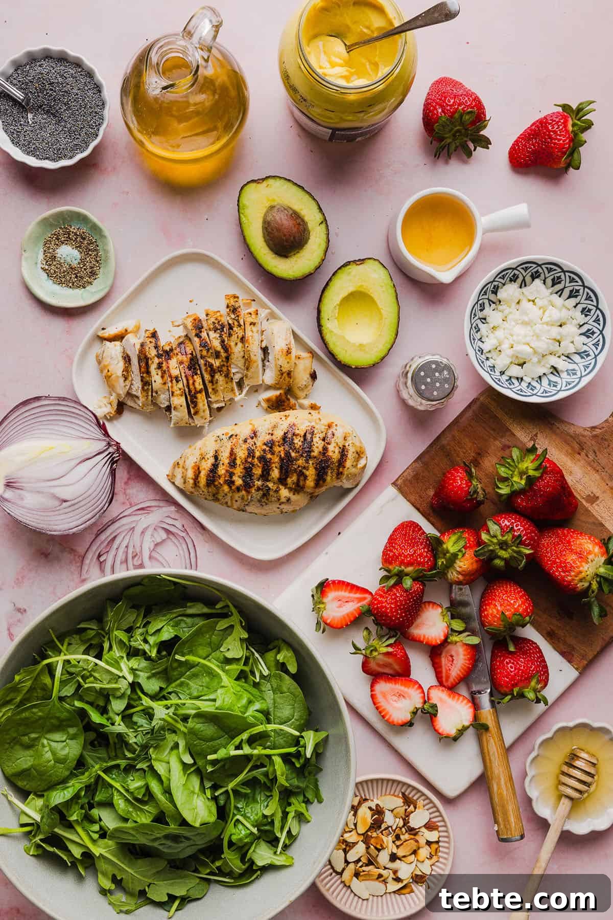 This Strawberry Poppy Seed Chicken Salad is fresh, flavorful, and perfect for spring and summer! Made with juicy strawberries, tender chicken, crunchy toppings, and the BEST poppy seed dressing.