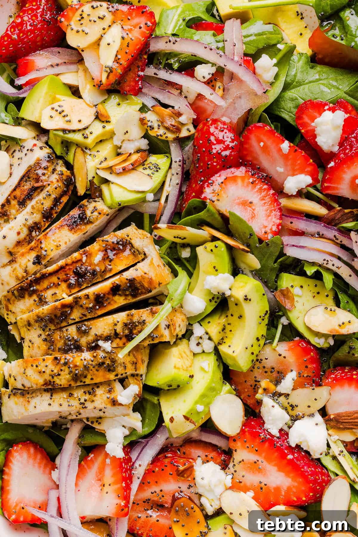This Strawberry Poppy Seed Chicken Salad is fresh, flavorful, and perfect for spring and summer! Made with juicy strawberries, tender chicken, crunchy toppings, and the BEST poppy seed dressing.