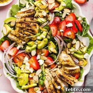 This Strawberry Poppy Seed Chicken Salad is fresh, flavorful, and perfect for spring and summer! Made with juicy strawberries, tender chicken, crunchy toppings, and the BEST poppy seed dressing.