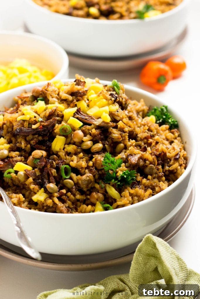 Trinidad Oxtail Pelau Recipe + Black History Month Virtual Potluck Guide 4 Trinidad Oxtail Pelau is a simple delicious spicy savory Caribbean dish with caramelized dark-brown meat or chicken served over a bed of rice.