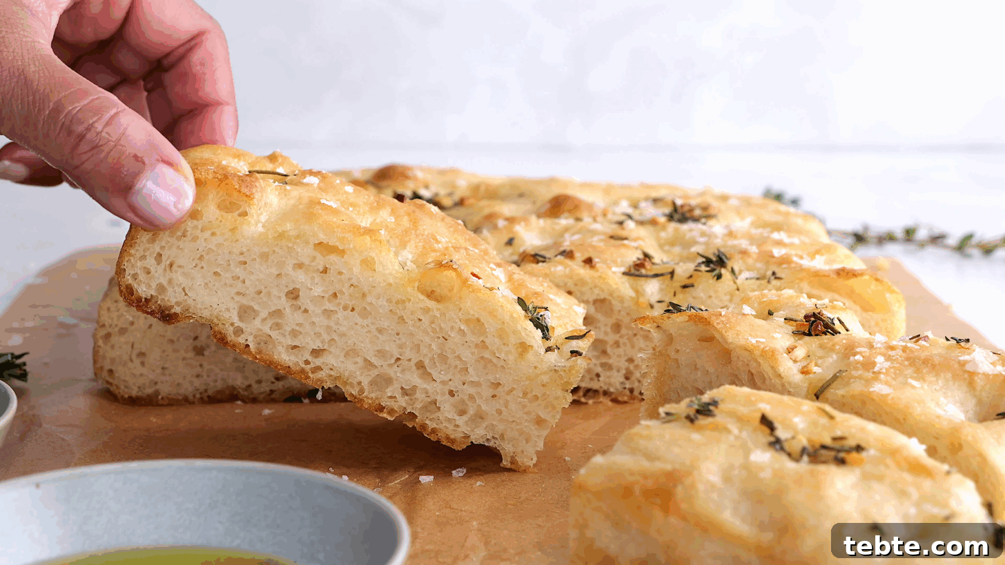 Homemade Garlic & Herb Focaccia Recipe From Scratch 5 Cross section of focaccia bread