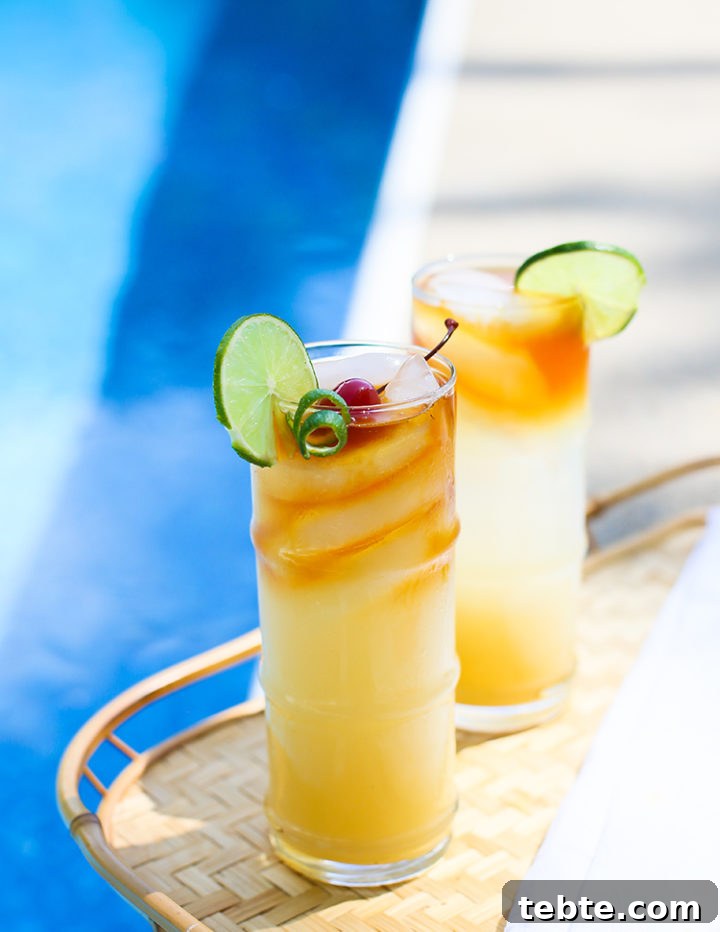 Classic Mai Tai Recipe: How to Make an Authentic Hawaiian Mai Tai 3 a photo of a tray by the pool with mai tai cocktails on it