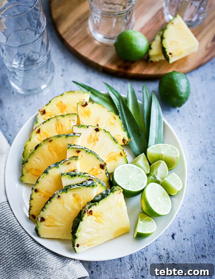 Classic Mai Tai Recipe: How to Make an Authentic Hawaiian Mai Tai 5 photo of fresh pineapple, limes, cocktail glasses, and other items needed to make a mai tai