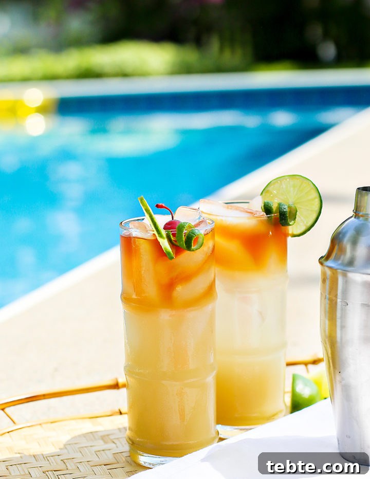 Classic Mai Tai Recipe: How to Make an Authentic Hawaiian Mai Tai 10 a photo of serving mai tais my the pool