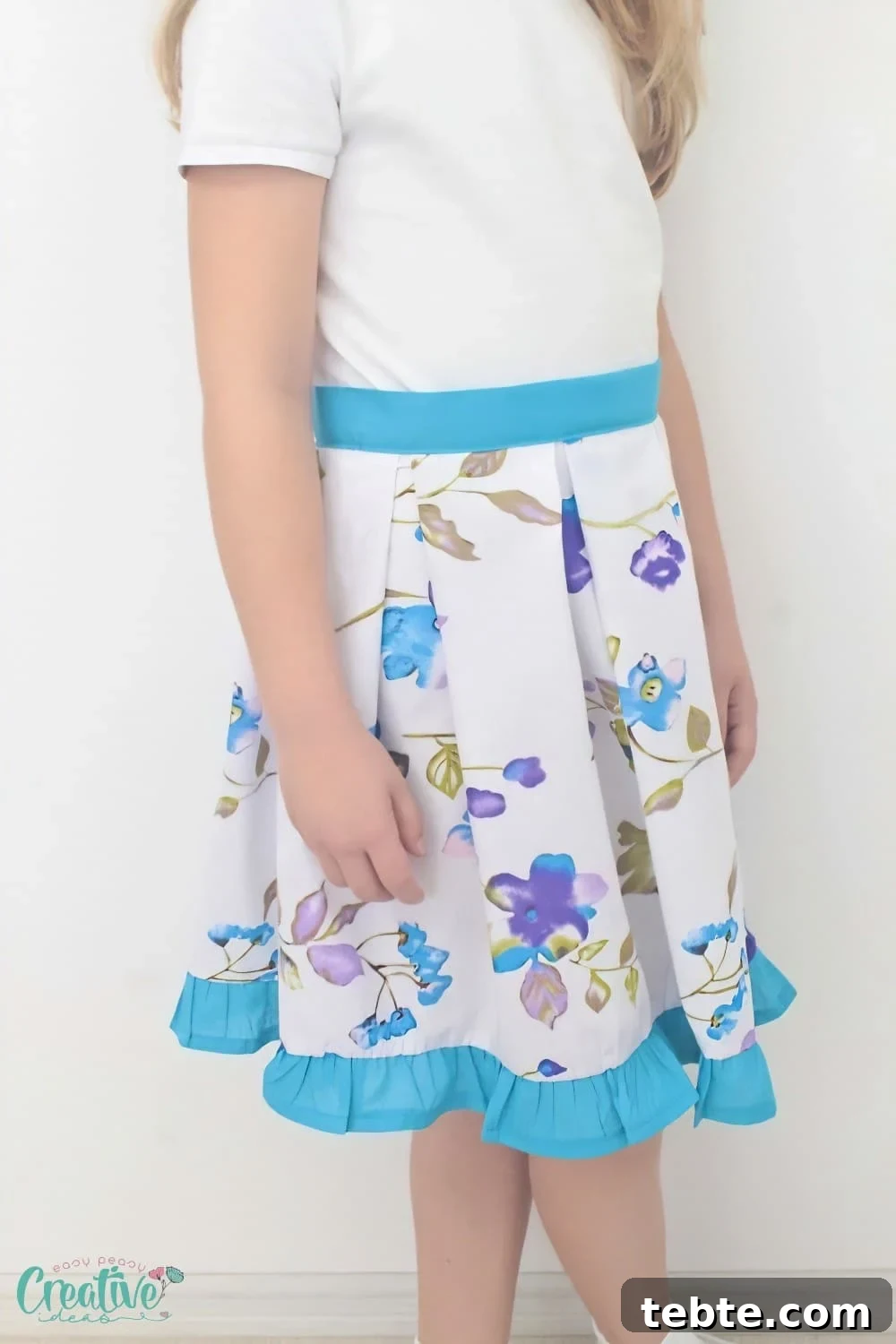 Box pleat midi skirt on a little girl