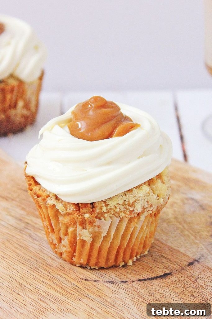 hot buttered rum cupcake on a wooden background