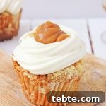 hot buttered rum cupcake on a wooden background