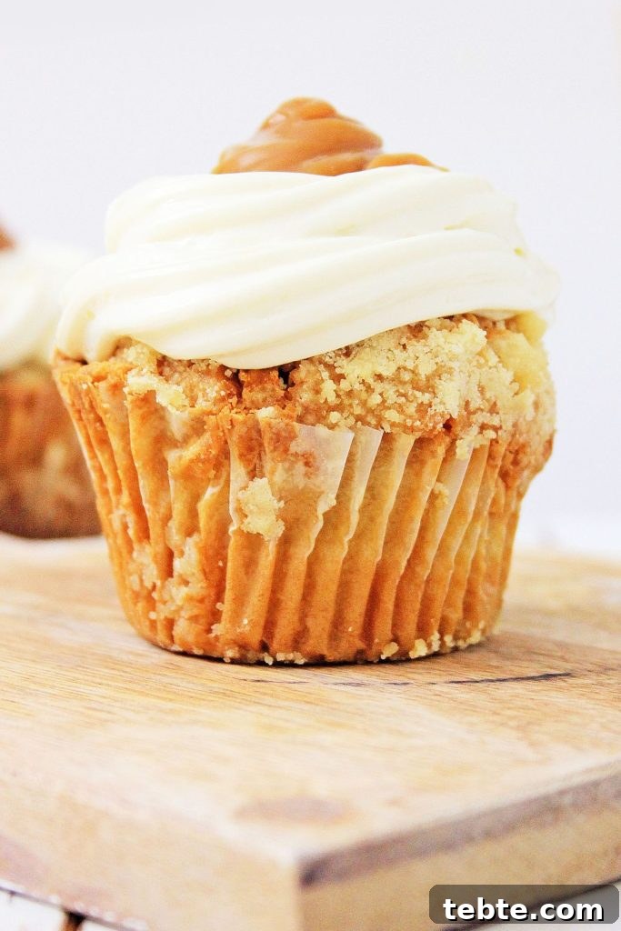 hot buttered rum cupcake from a wooden cutting board