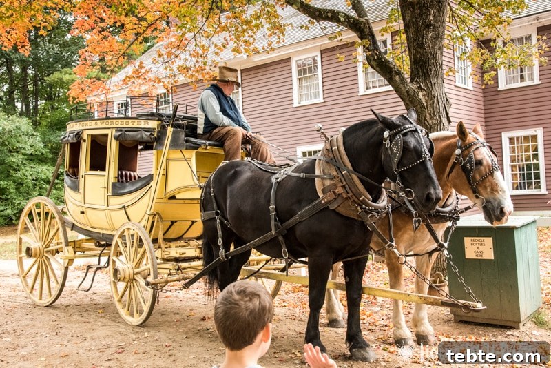 10 Compelling Reasons to Visit Old Sturbridge Village PMID 13 A horse drawn carriage in front of a house