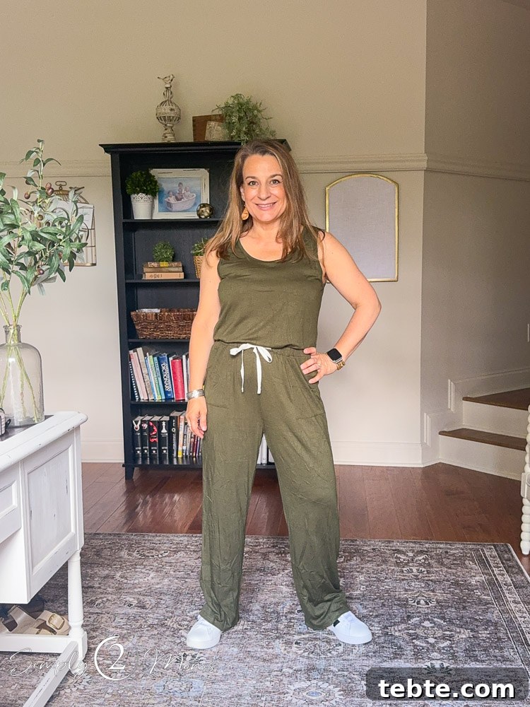 8 Adorable Amazon Jumpsuits and Sundresses You’ll Love 2 Woman wearing a sleeveless romper with a tied waist detail.