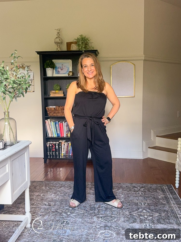 8 Adorable Amazon Jumpsuits and Sundresses You’ll Love 12 Woman wearing a sleeveless jumpsuit with belted waist and Birkenstocks.