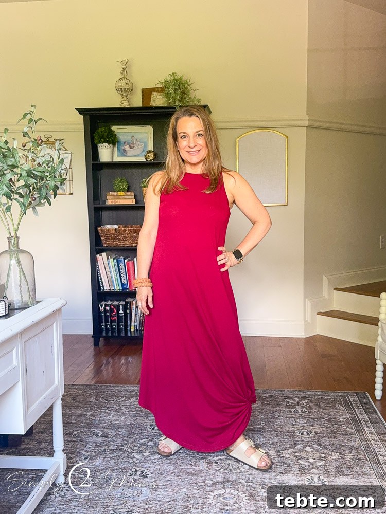 8 Adorable Amazon Jumpsuits and Sundresses You’ll Love 16 Woman wearing a sleeveless maxi dress knotted at the bottom to shorten it.