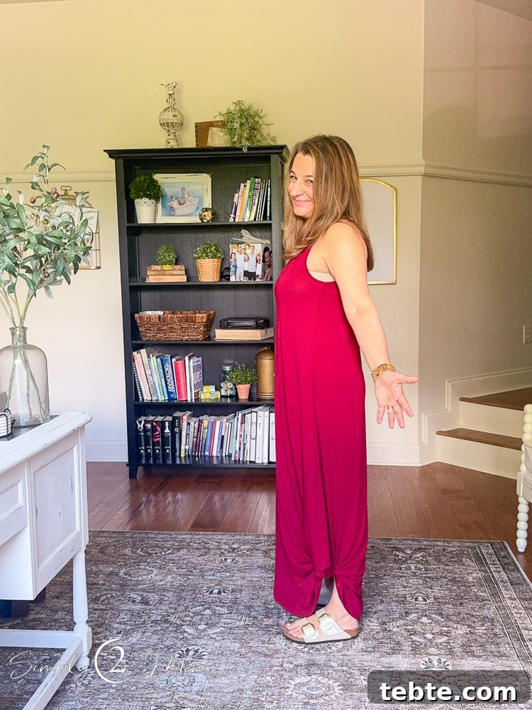 8 Adorable Amazon Jumpsuits and Sundresses You’ll Love 17 Woman wearing a loose fitting sleeveless maxi dress from the side.