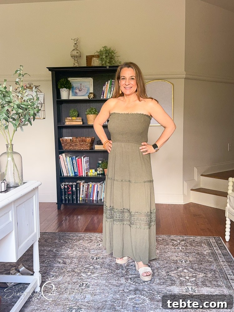 8 Adorable Amazon Jumpsuits and Sundresses You’ll Love 19 Woman wearing a strapless sundress with tiered skirt and lace detail.