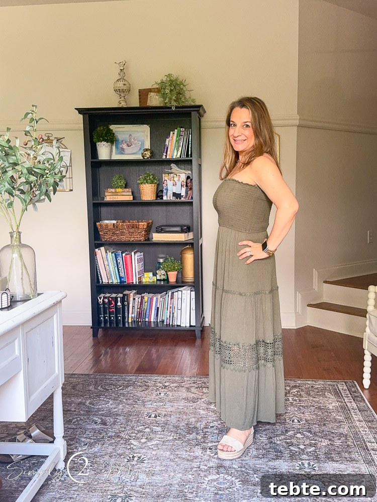 8 Adorable Amazon Jumpsuits and Sundresses You’ll Love 20 Woman wearing a strapless sundress with tiered skirt and lace detail from the side.