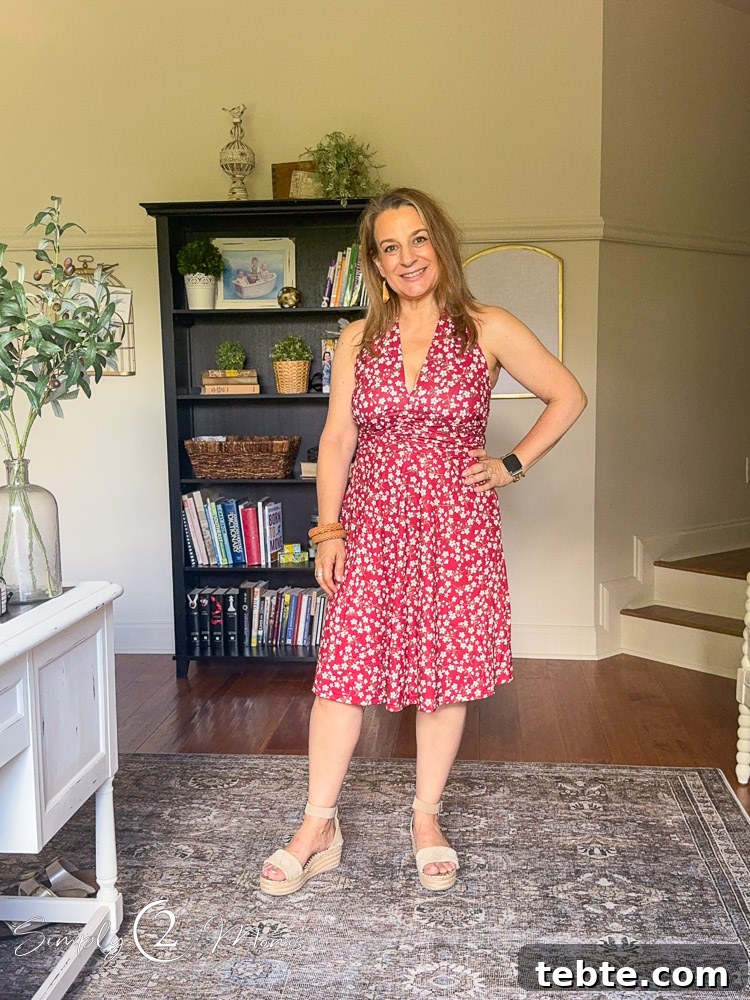 8 Adorable Amazon Jumpsuits and Sundresses You’ll Love 24 Woman wearing red floral halter sundress from Amazon with pockets.