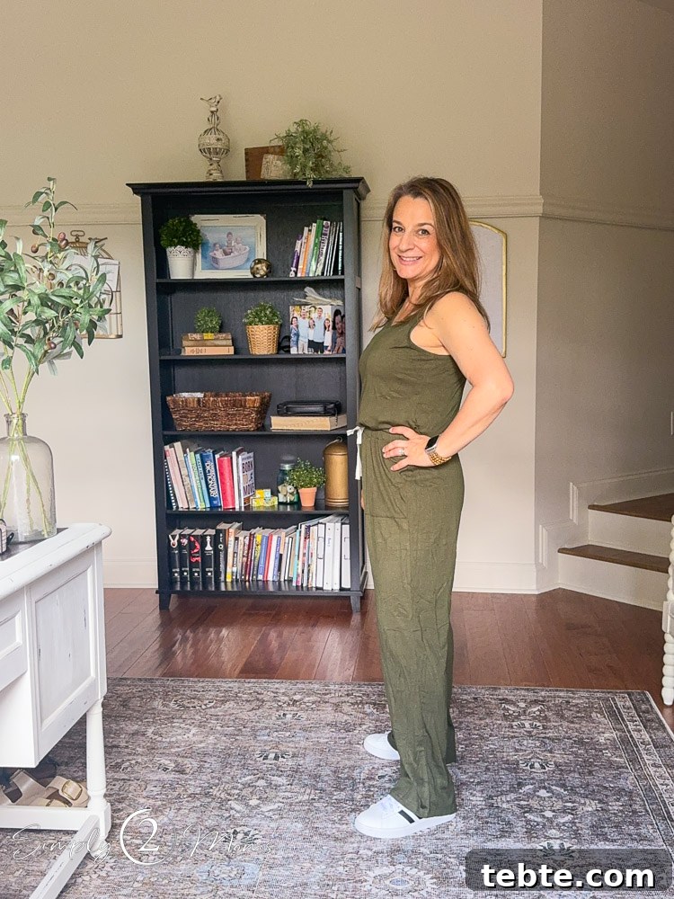 8 Adorable Amazon Jumpsuits and Sundresses You’ll Love 4 Woman wearing a sleeveless romper with tied waist detail from the side.