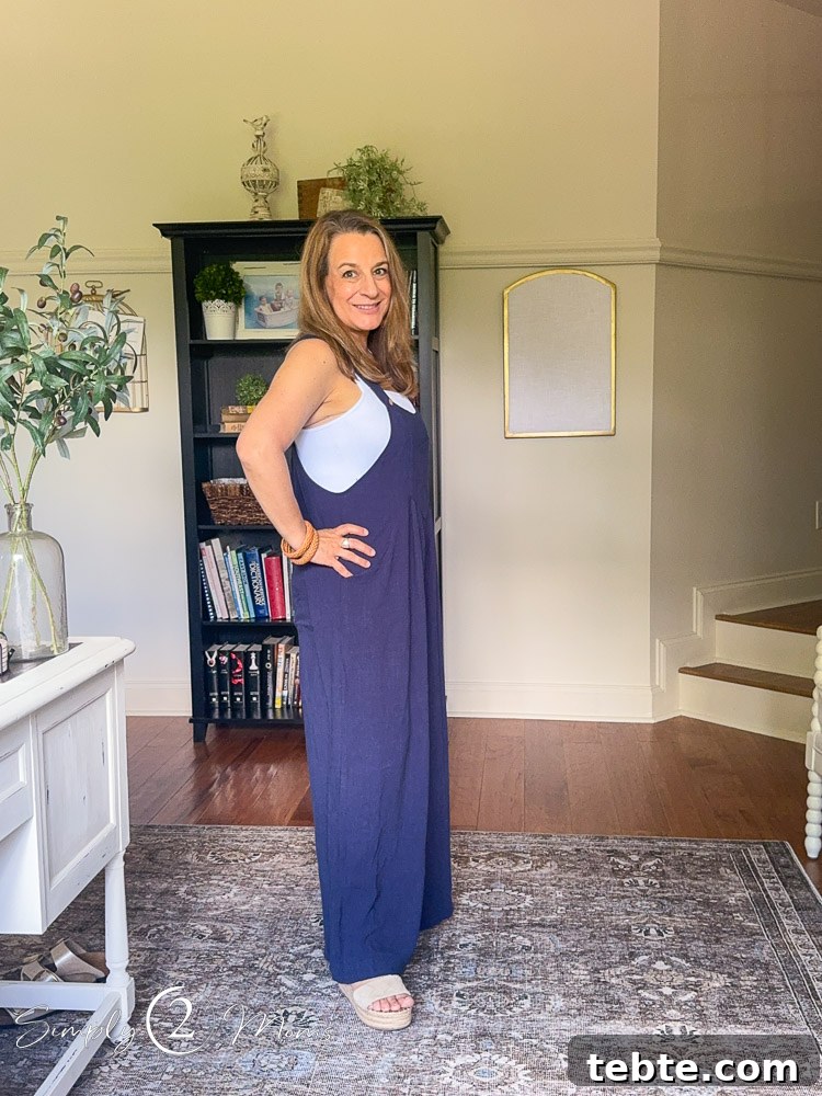 8 Adorable Amazon Jumpsuits and Sundresses You’ll Love 6 Woman wearing wide legged overalls with sleeveless body suit from the side.