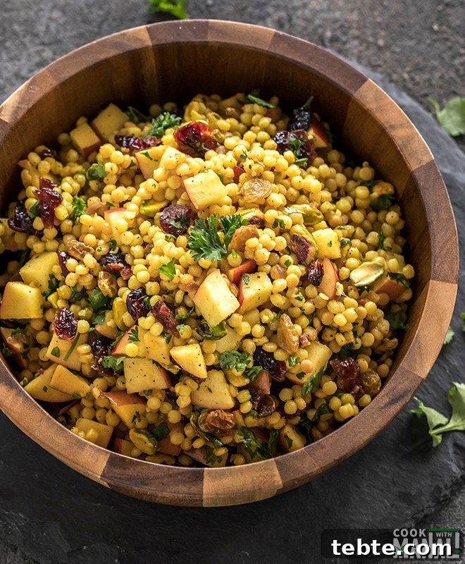 Israeli Couscous-Stuffed Acorn Squash with Herbs and Feta 3 israeli couscous salad in a wooden salad bowl