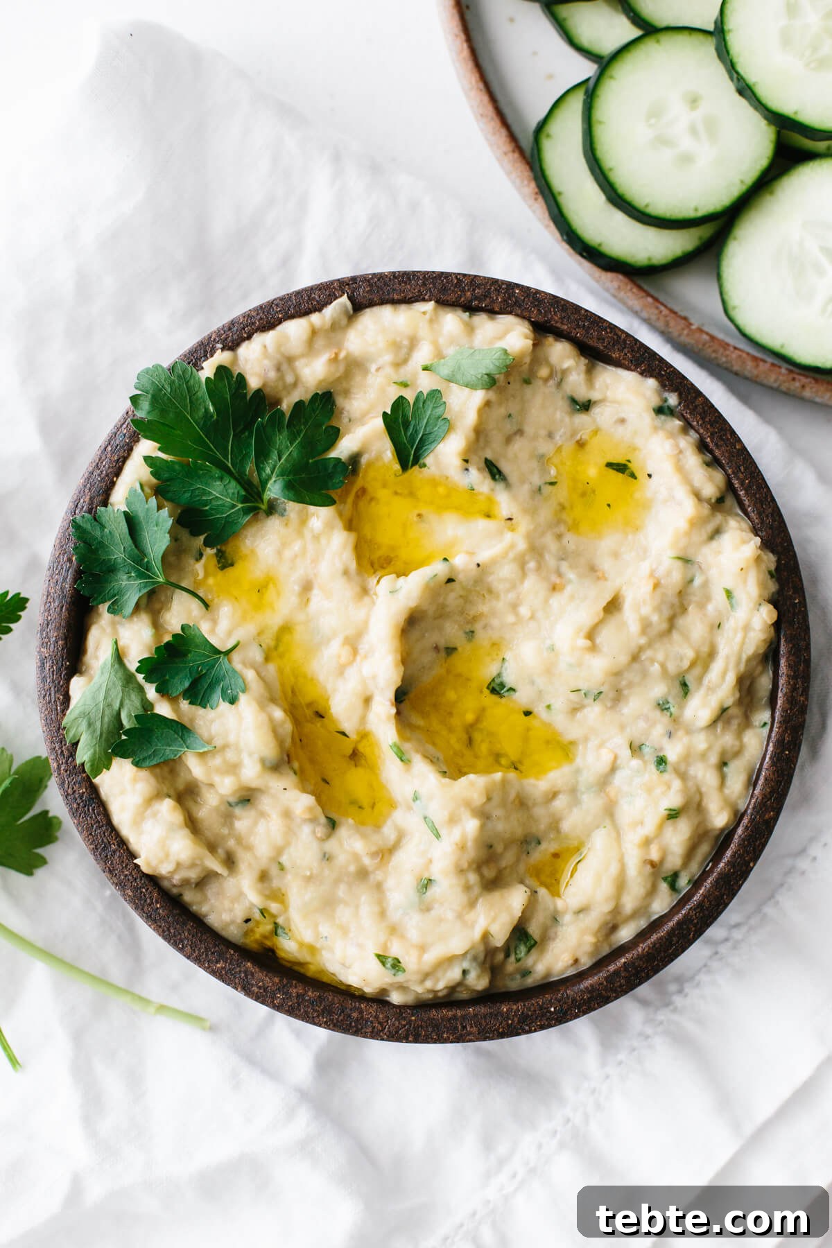 Baba ganoush in a bowl with garnish.