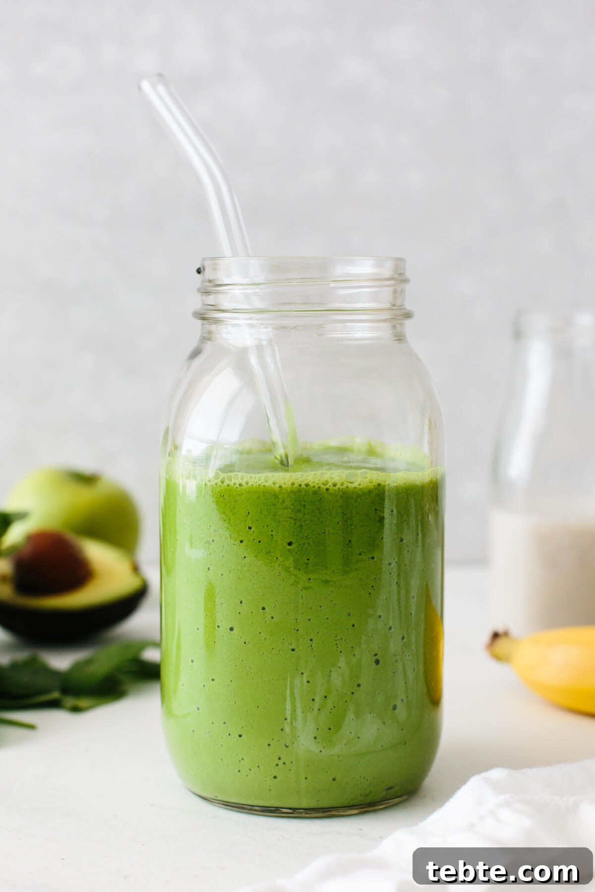 Green smoothie recipe in a glass.