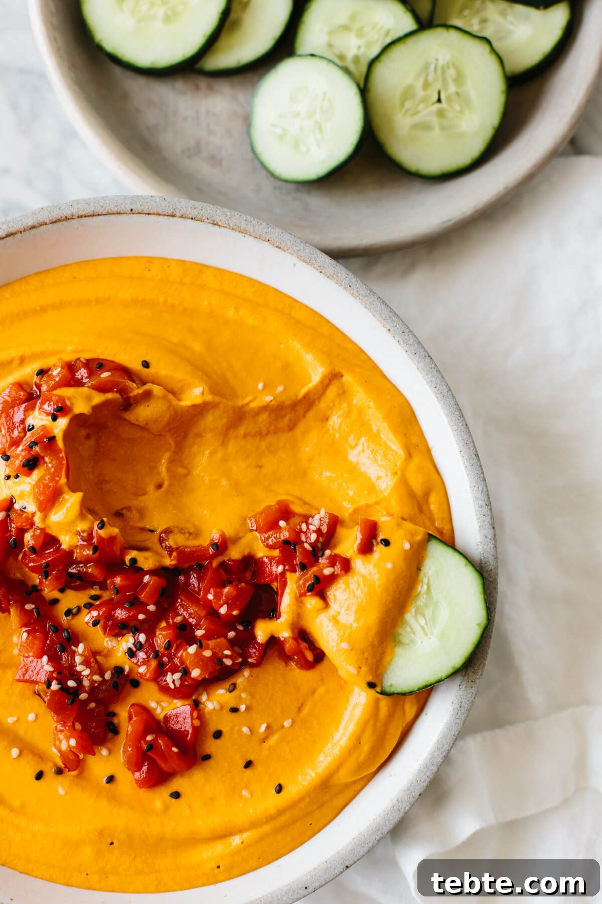 Roasted red pepper hummus is incredibly easy to make at home with just a few ingredients. It's creamy, smooth, slightly smoky and full of flavor - a great healthy snack recipe!