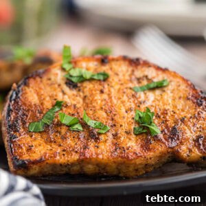 Hawaiian-Style Grilled Pork Chops with Pineapple Glaze 12 Grilled Pork Chops on a plate