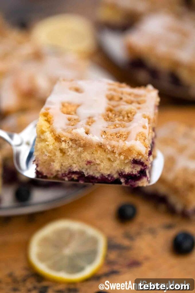 Perfect Blueberry Buckle Recipe for Moist, Tender Cake 6 Blueberry buckle bar on a serving spatula