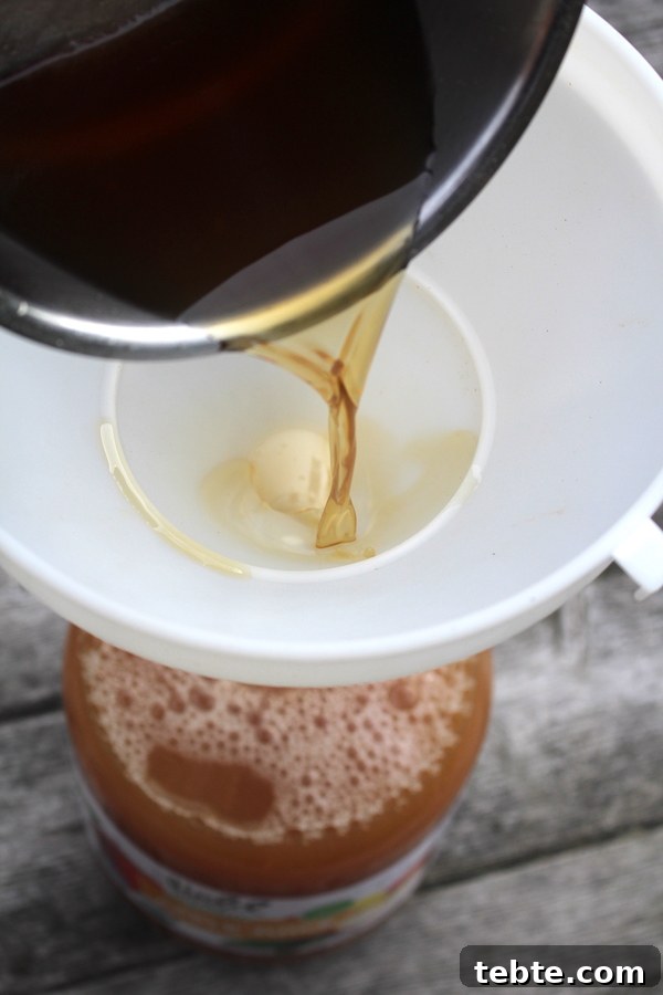 30+ Proven Methods for Preserving Apples All Year Round 20 Winemaking additives going into a jug of apple juice before it's fermented into apple wine.