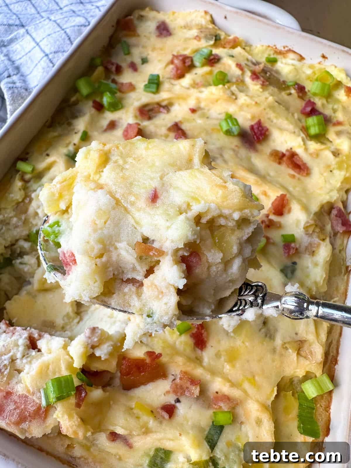 Twice-Baked Potato Casserole: Loaded Mashed Potato Bake 2 A scoop of mashed potato casserole.