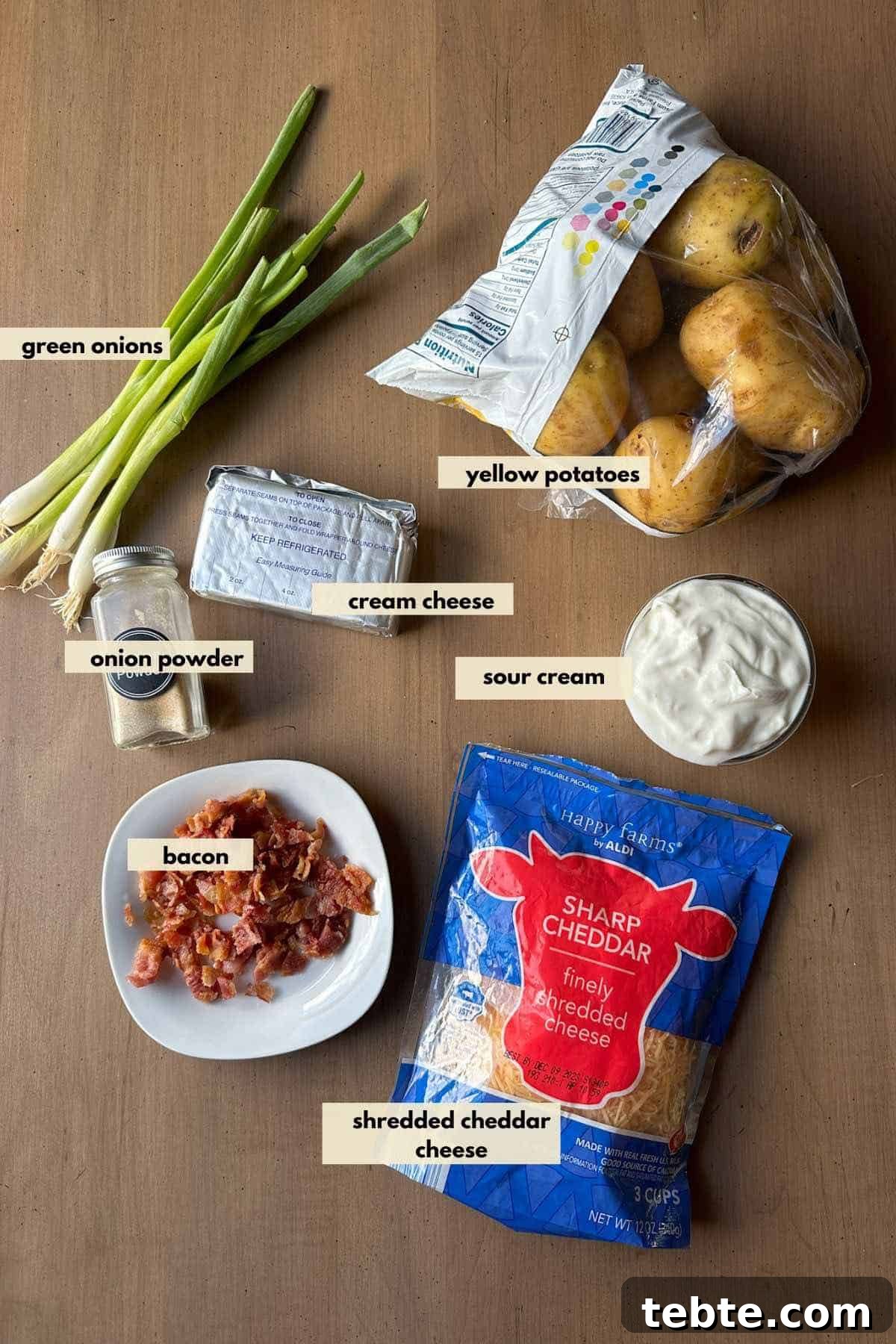 Twice-Baked Potato Casserole: Loaded Mashed Potato Bake 3 Ingredients are grated cheddar cheese, bacon pieces, cream cheese, sour cream, Yukon gold potatoes and green onions.