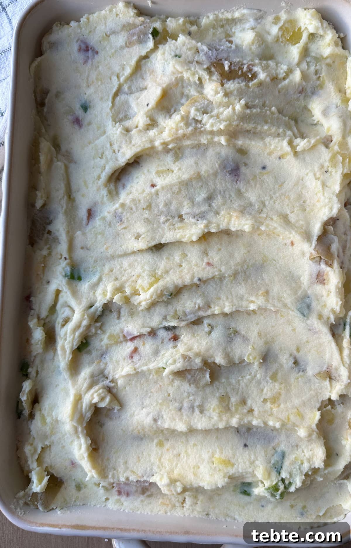 Twice-Baked Potato Casserole: Loaded Mashed Potato Bake 8 Twice baked mashed potatoes in a baking dish.