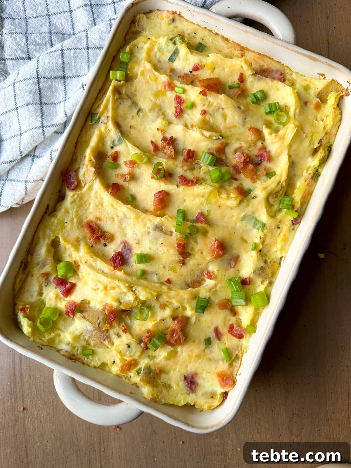 Twice-Baked Potato Casserole: Loaded Mashed Potato Bake 9 A twice baked mashed potato casserole on a countertop.