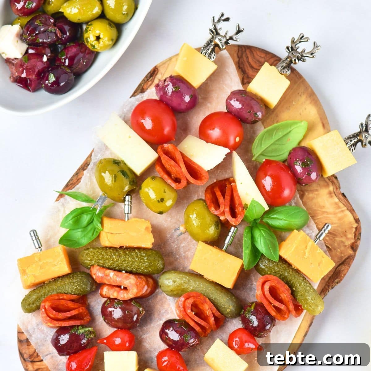 76 Gluten-Free Game Day Snacks to Share with Friends 13 Charcuterie skewers on wooden board.